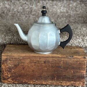 Elegant Silver Teapot with Black Handle